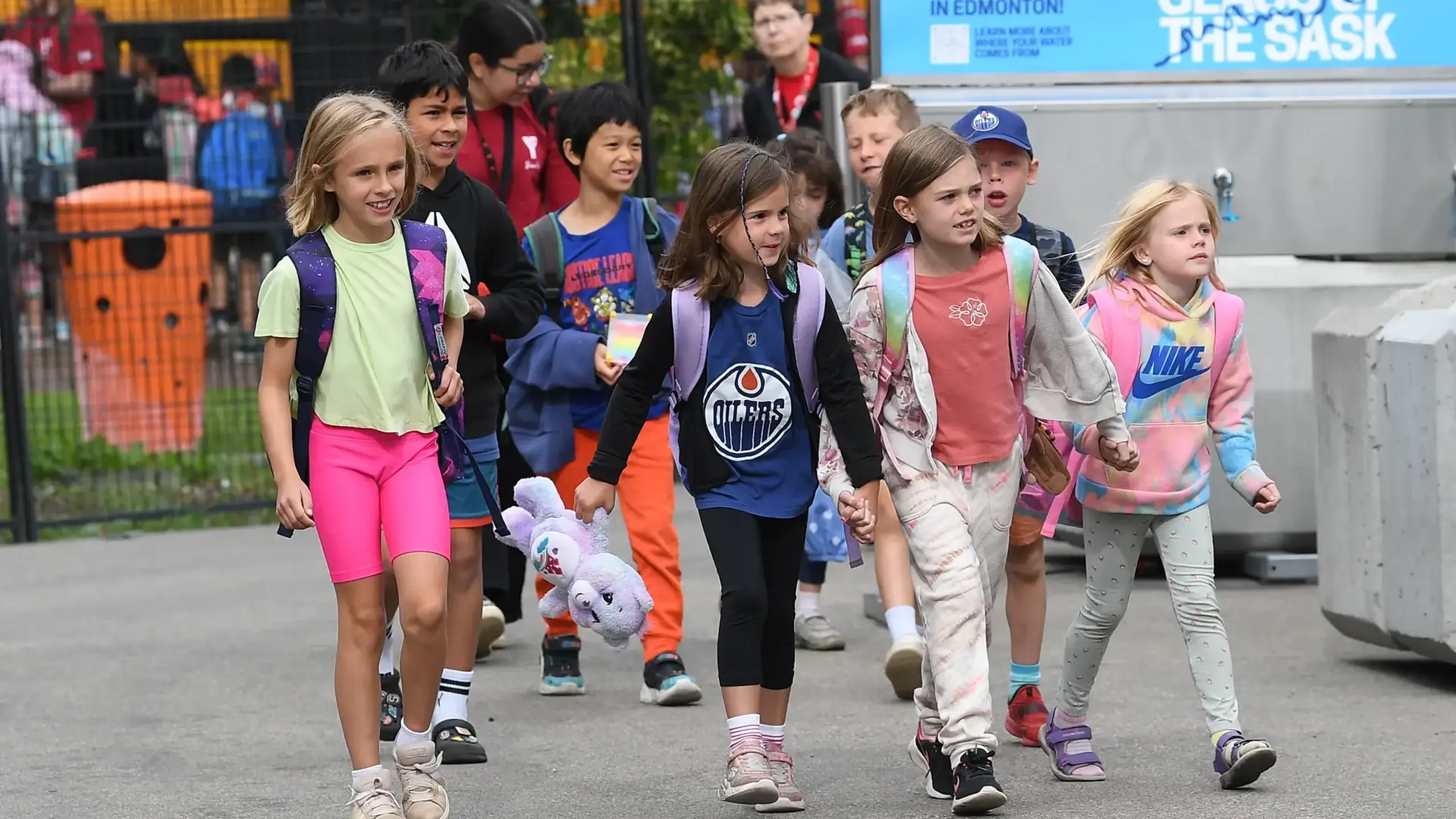 Children walking together at an Oilers community event